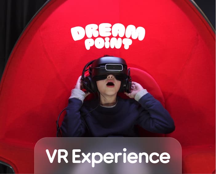 A child wearing a VR headset in a Dream Point VR pod